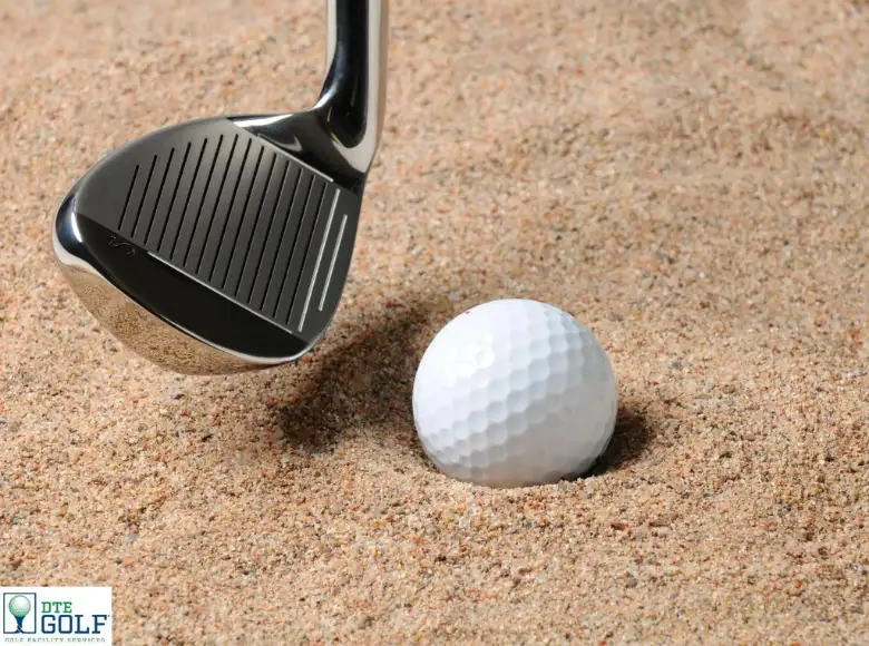 Golf course crew maintaining bunker sand for consistent playability